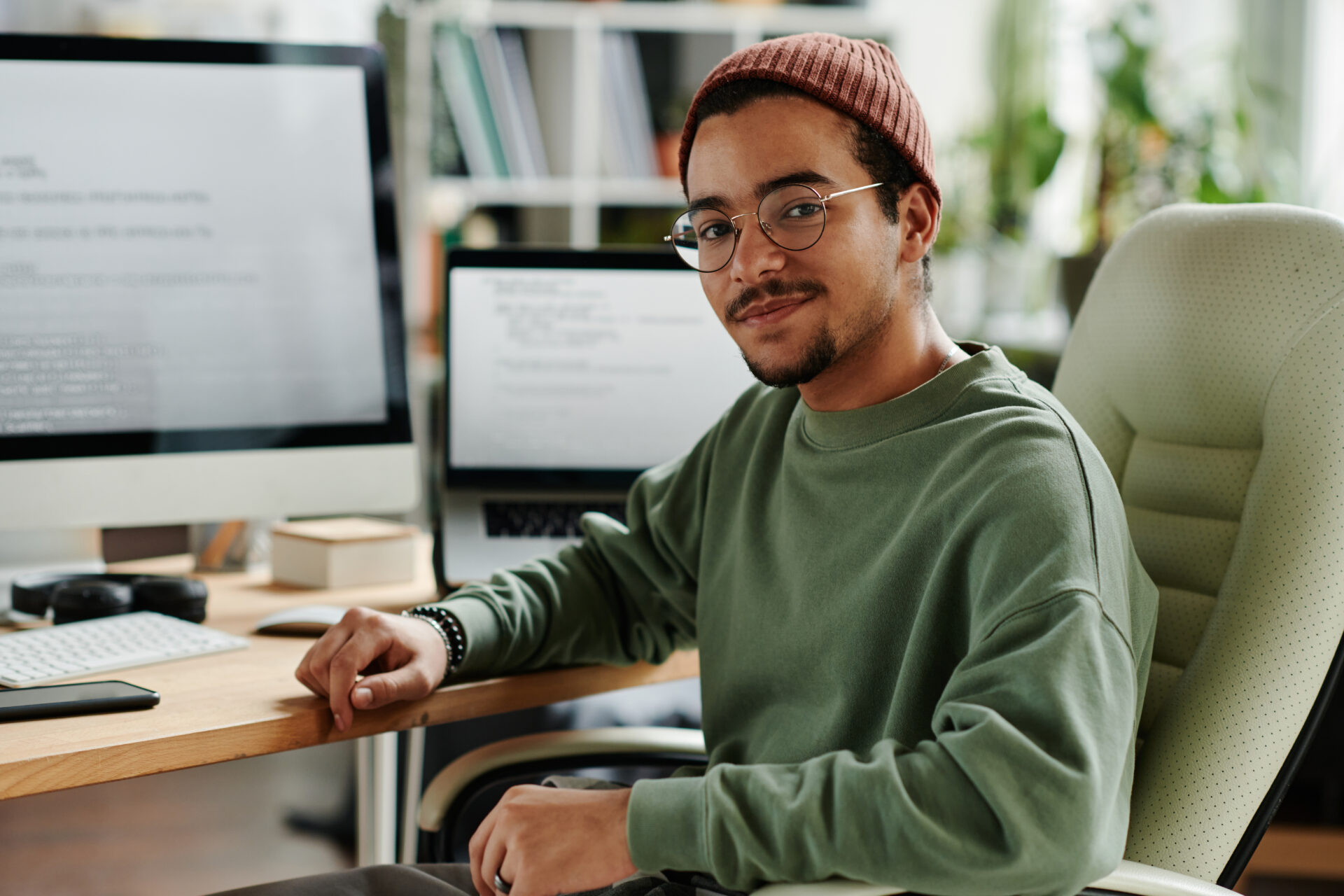 Young confident IT engineer or software developer in casualwear