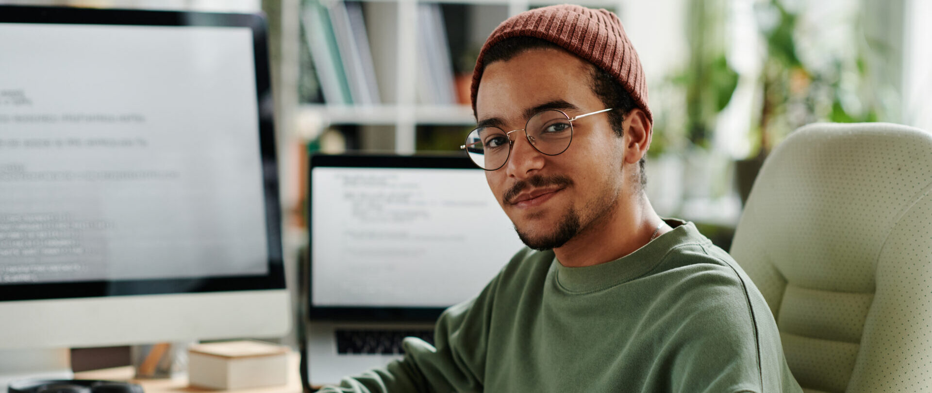 Young confident IT engineer or software developer in casualwear