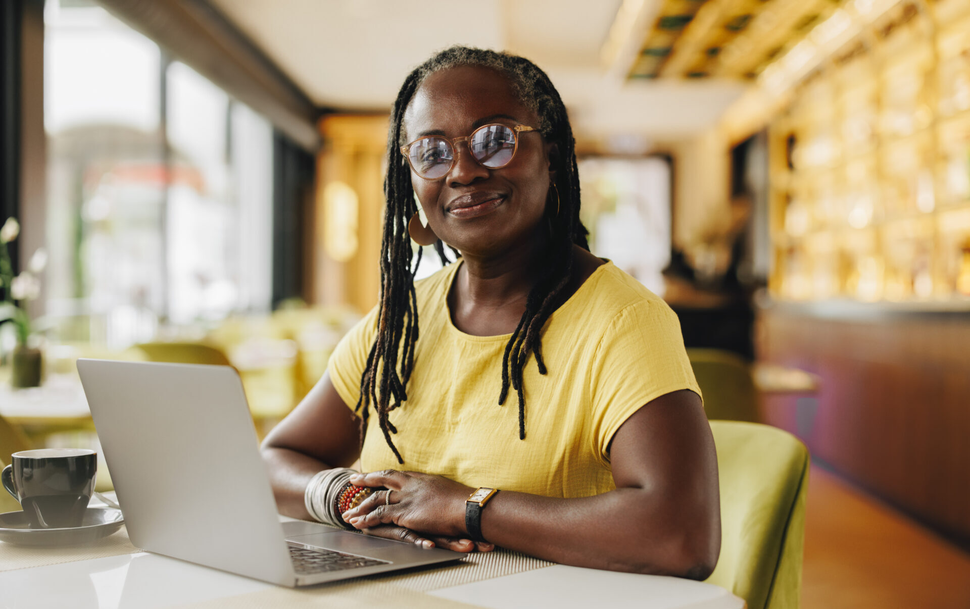 Confident businesswoman working in a cafe