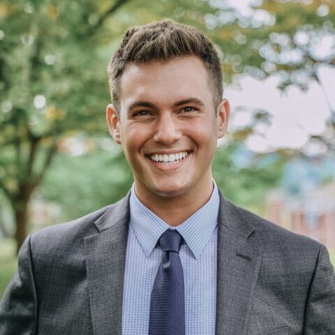 Blaze bowers headshot with a blurred tree in the background